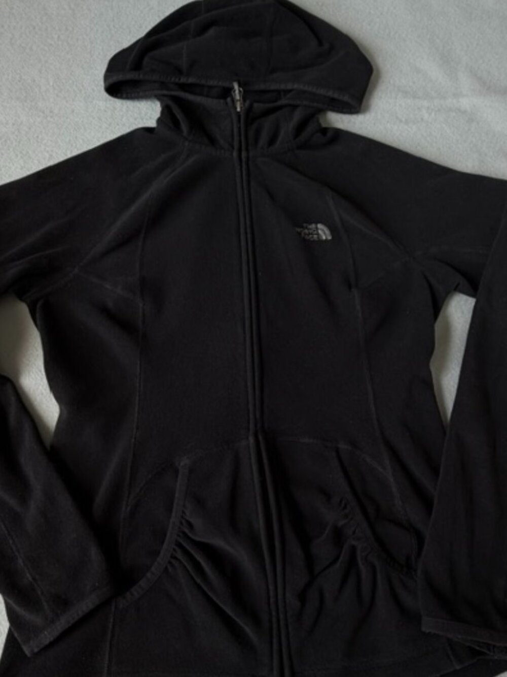The North Face women's sweater full zipper and pockets in fair condition Small